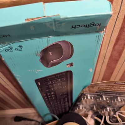 Assortment Of Cords Lights Batteries Logitech Keyboard