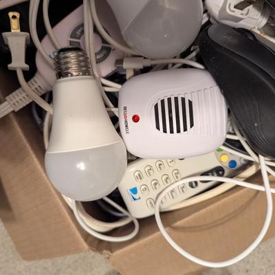 Assortment Of Cords Lights Batteries Logitech Keyboard