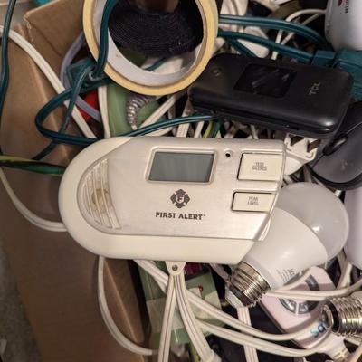 Assortment Of Cords Lights Batteries Logitech Keyboard