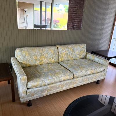 Sale Photo Thumbnail #31: This sofa is a multicolor, mid-century modern piece designed for the living room. It features a floral upholstery fabric and offers seating for three adults. The sofa measures 71 inches in length, 32 inches in width, and 21 inches in height, with a seat h
