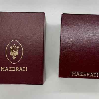 Sale Photo Thumbnail #245: Quartz movement, silvered dial, gilt luminous numeral dots. comes with Maserati boxes (see photos).
Case: gold plated, black lined bezel, vintage dash clock shape, screw secured back, 56 mm x 40 mm, glass crystal
Condition: Looks great, no scratches on cr