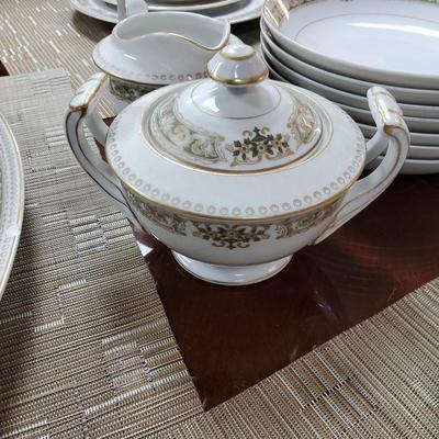 Sale Photo Thumbnail #6: 2 serving platters, 11 dinner plates, 12 salad plates, 11 bread & butter plates, 17 teacups, 12 saucers, 12 dessert bowls, 11 soup bowls, cream & sugar and gravy boat.

One or two pieces have chips but the setbas a whole is in great condition