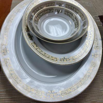 Sale Photo Thumbnail #5: 2 serving platters, 11 dinner plates, 12 salad plates, 11 bread & butter plates, 17 teacups, 12 saucers, 12 dessert bowls, 11 soup bowls, cream & sugar and gravy boat.

One or two pieces have chips but the setbas a whole is in great condition