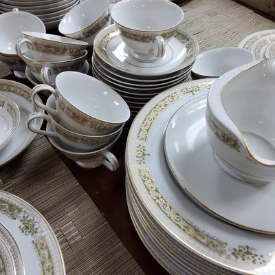 Sale Photo Thumbnail #7: 2 serving platters, 11 dinner plates, 12 salad plates, 11 bread & butter plates, 17 teacups, 12 saucers, 12 dessert bowls, 11 soup bowls, cream & sugar and gravy boat.

One or two pieces have chips but the setbas a whole is in great condition