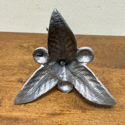 Sale Photo Thumbnail #348: Leaf tripod base. Missing the candle holder at the top.  In good condition, approx. x" tall.