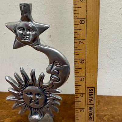 Sale Photo Thumbnail #350: Leaf tripod base. Missing the candle holder at the top.  In good condition, approx. x" tall.