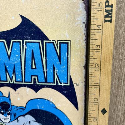 Sale Photo Thumbnail #169: Painted metal sign with an image of the classic 1930’s DC comics Batman. Image is distressed to make it look old.