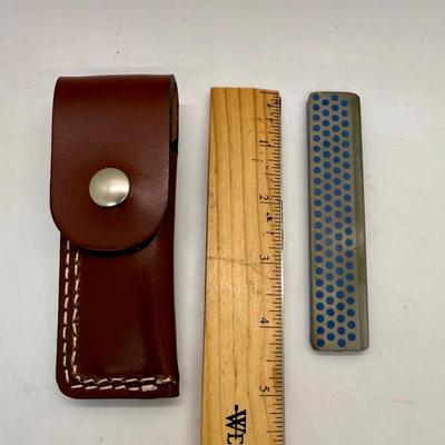 Sale Photo Thumbnail #477: Used, but in good condition. Comes with a leather carrying pouch with a belt loop. Can be used to sharpen different types of tools, including gardening tools.