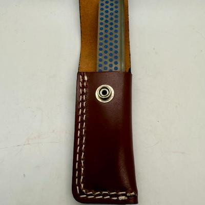 Sale Photo Thumbnail #475: Used, but in good condition. Comes with a leather carrying pouch with a belt loop. Can be used to sharpen different types of tools, including gardening tools.