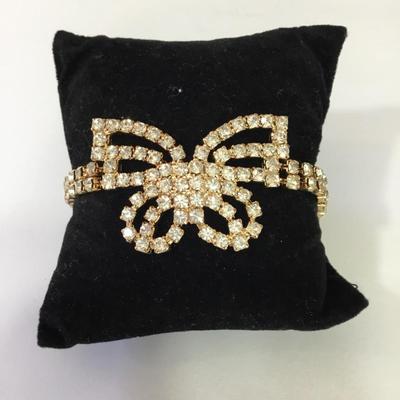 Pretty gold, toned, rhinestone butterfly bracelet