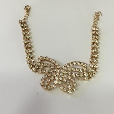 Pretty gold, toned, rhinestone butterfly bracelet
