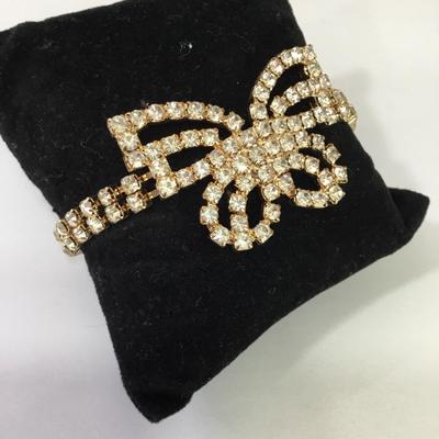 Pretty gold, toned, rhinestone butterfly bracelet