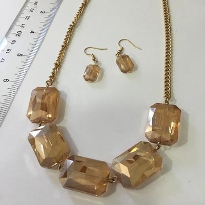 Beautiful peach, faceted, glass, necklace, and matching earrings