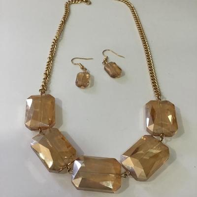 Beautiful peach, faceted, glass, necklace, and matching earrings