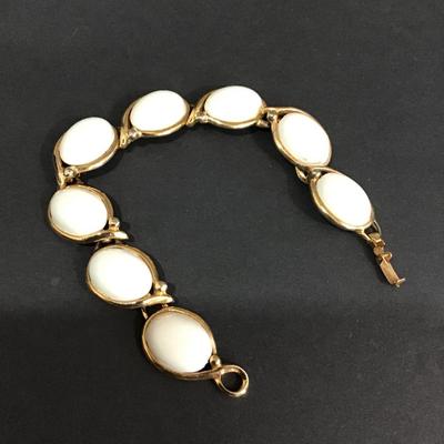 Vintage gold tone bracelet with white cabachon