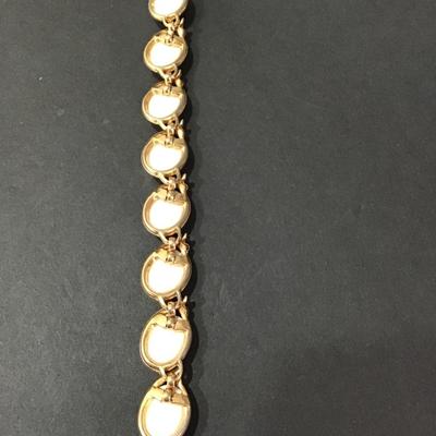 Vintage gold tone bracelet with white cabachon