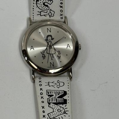 Sale Photo Thumbnail #105: Silver tone dial, white band with inscription. Needs a new battery.
