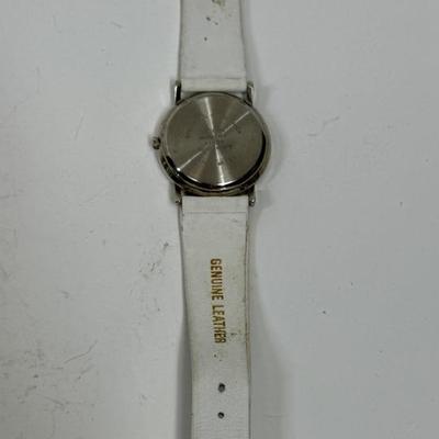 Sale Photo Thumbnail #104: Silver tone dial, white band with inscription. Needs a new battery.