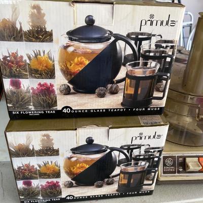 Sale Photo Thumbnail #25: Tea pots,  cast iron skillet, small appliances and more.