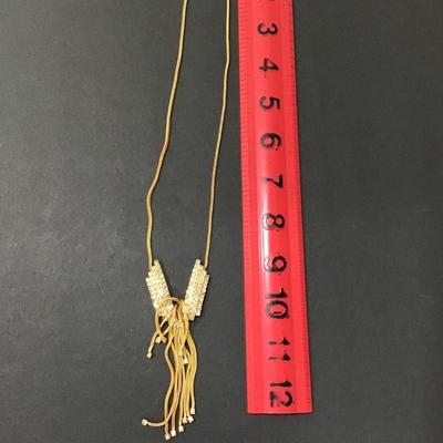 Sale Photo Thumbnail #64: Gold tone rhinestone necklace with Tassel 
Please see attached photos