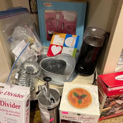 Sale Photo Thumbnail #86: Cookie sheets, cookie cutters, Cookie 
press, cake pans, and more.
