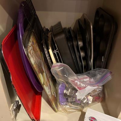 Sale Photo Thumbnail #85: Cookie sheets, cookie cutters, Cookie 
press, cake pans, and more.