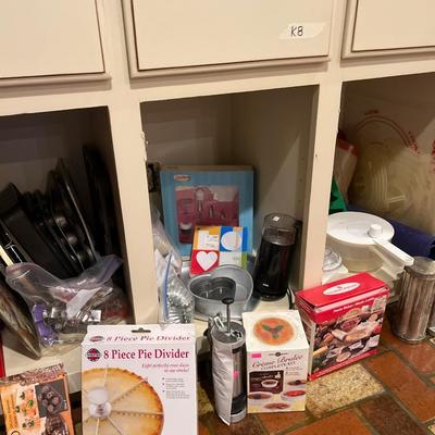 Sale Photo Thumbnail #84: Cookie sheets, cookie cutters, Cookie 
press, cake pans, and more.