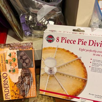 Sale Photo Thumbnail #87: Cookie sheets, cookie cutters, Cookie 
press, cake pans, and more.
