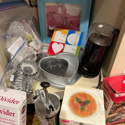Sale Photo Thumbnail #88: Cookie sheets, cookie cutters, Cookie 
press, cake pans, and more.