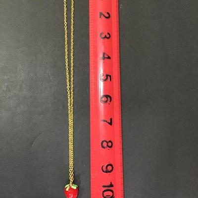Sale Photo Thumbnail #128: Gold tone chain with glass strawberry pendant 
Please see attached photos