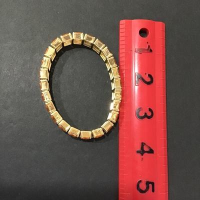 Sale Photo Thumbnail #158: Gold tone fashion stretch bracelet 
Like new 
Please see attached photos