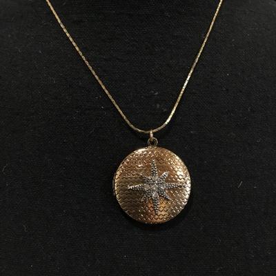 Beautiful vintage, gold toned north star locket necklace long