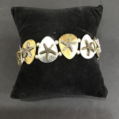 Siver and gold toned star fish stretch bracelet