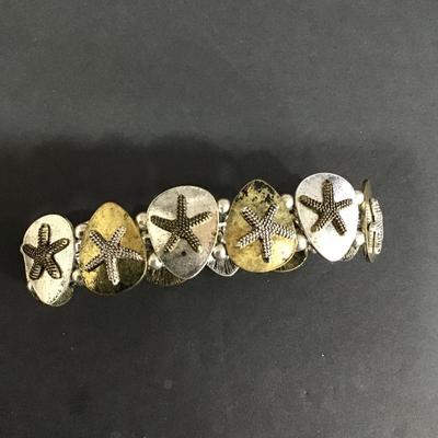 Siver and gold toned star fish stretch bracelet
