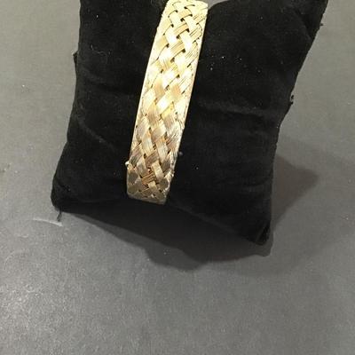 Gold tone meshed, hinged bracelet
