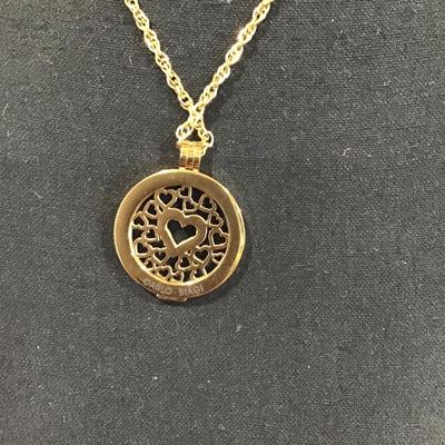 Gold tone chain with gold tone Carlo biagi coin pendant with rhinestones