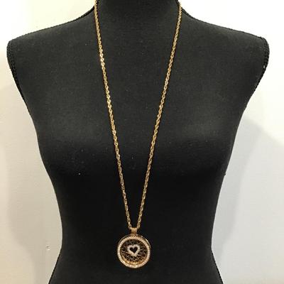 Gold tone chain with gold tone Carlo biagi coin pendant with rhinestones