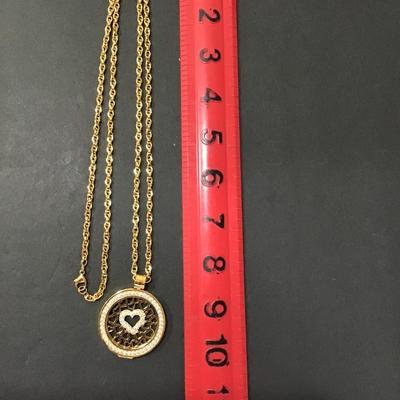 Gold tone chain with gold tone Carlo biagi coin pendant with rhinestones