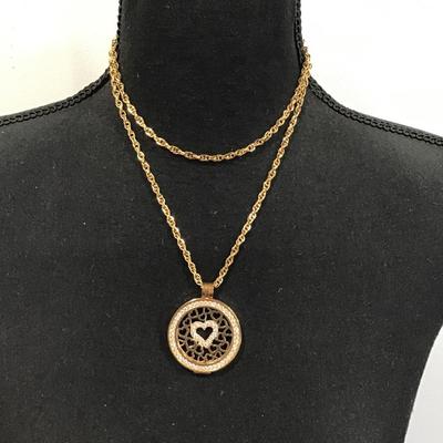 Gold tone chain with gold tone Carlo biagi coin pendant with rhinestones