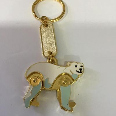 Nice cute enameled and gold toned, Alaska polar bear keychain articulating