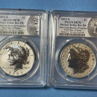 PCGS CERTIFIED SET OF 2023-S REVERSE PROOF70 FIRST DAY OF ISSUE MORGAN & PEACE SILVER DOLLARS AS PICTURED.