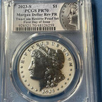 PCGS CERTIFIED SET OF 2023-S REVERSE PROOF70 FIRST DAY OF ISSUE MORGAN & PEACE SILVER DOLLARS AS PICTURED.