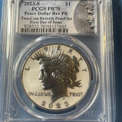 PCGS CERTIFIED SET OF 2023-S REVERSE PROOF70 FIRST DAY OF ISSUE MORGAN & PEACE SILVER DOLLARS AS PICTURED.