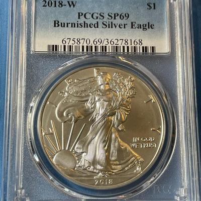PCGS CERTIFIED 2018-W SP69 GRADED BURNISHED SILVER EAGLE DOLLAR .999 SILVER AS PICTURED. (COIN #168).