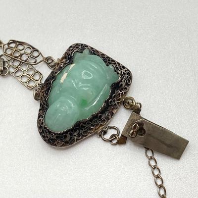 LOT 62: 10KT, TW 21.44g- 10k THC White Gold Carved Jadite Buddha Bracelet