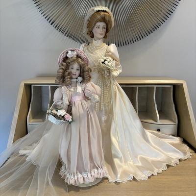 LOT 85: Porcelain Dolls a Bride and Her Flower Girl