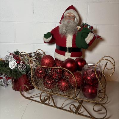LOT 106: Holiday Decor: Santa Figure, Gold Wire Sleigh, Floral Centerpiece and More