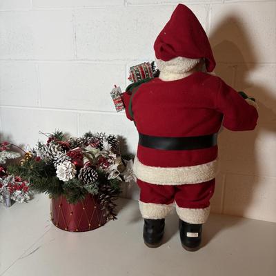 LOT 106: Holiday Decor: Santa Figure, Gold Wire Sleigh, Floral Centerpiece and More