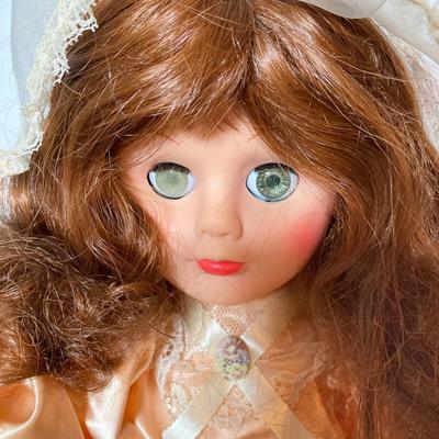 LOT 283: Holiday Decor Collection - Fiber Optic Poinsettia Trees and Animated Dolls