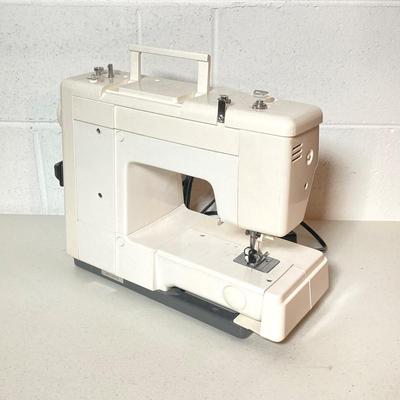LOT 187: Brother Sewing Machine and Oreck Cord Free TX850 Iron